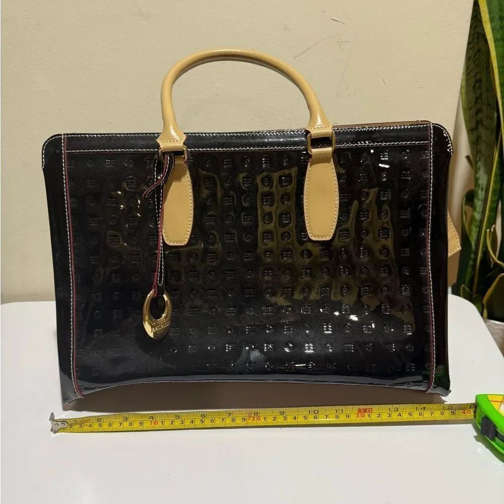 Arcadia Black Patent
Leather Crossbody Straps and goldtone tag Black Tote